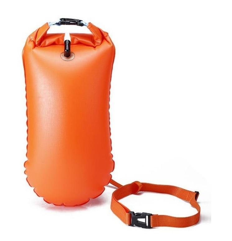 An orange float bag with a strap Description automatically generated